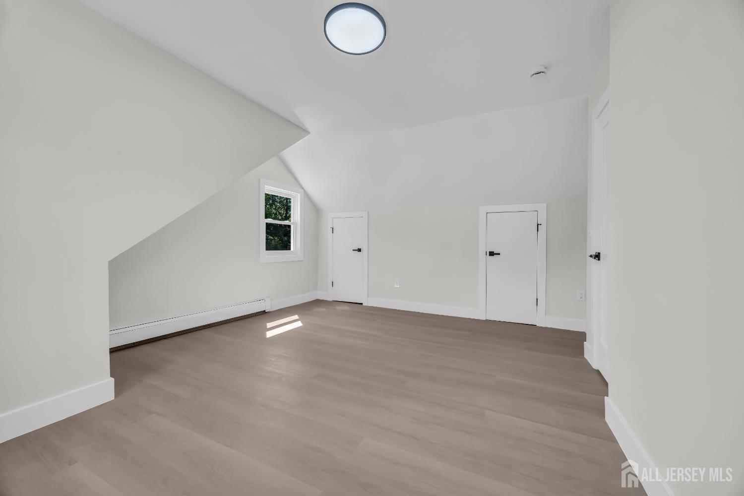 37 North Randolphville Road Piscataway, NJ 08854 - Photo 15 of 31 an empty room with wooden floor and windows