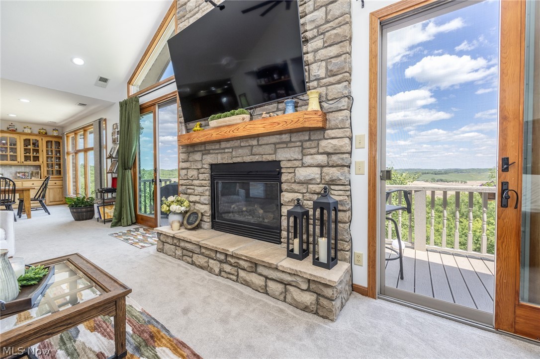 1602 Glendale Road, Unit 3 Marietta, OH 45750 - Photo 8 of 49 Stone fireplace with a substantial hearth and wood mantel