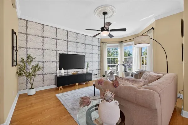 a living room with furniture and a flat screen tv