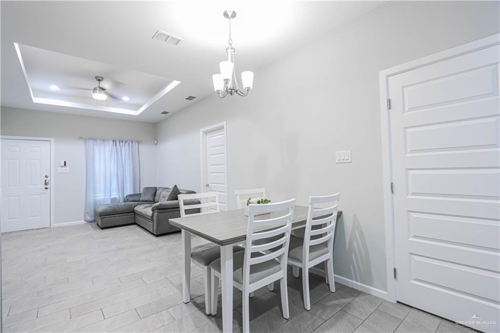 913 West Sunset Valley Street Mission, TX 78573 - Photo 13 of 24 a view of a dining room with furniture