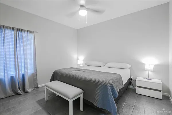 a bathroom with a shower sink and mirror