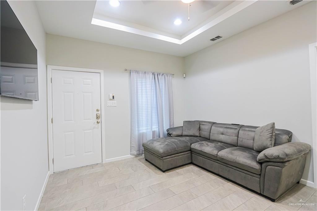 913 West Sunset Valley Street Mission, TX 78573 - Photo 9 of 24 a living room with furniture and a couch