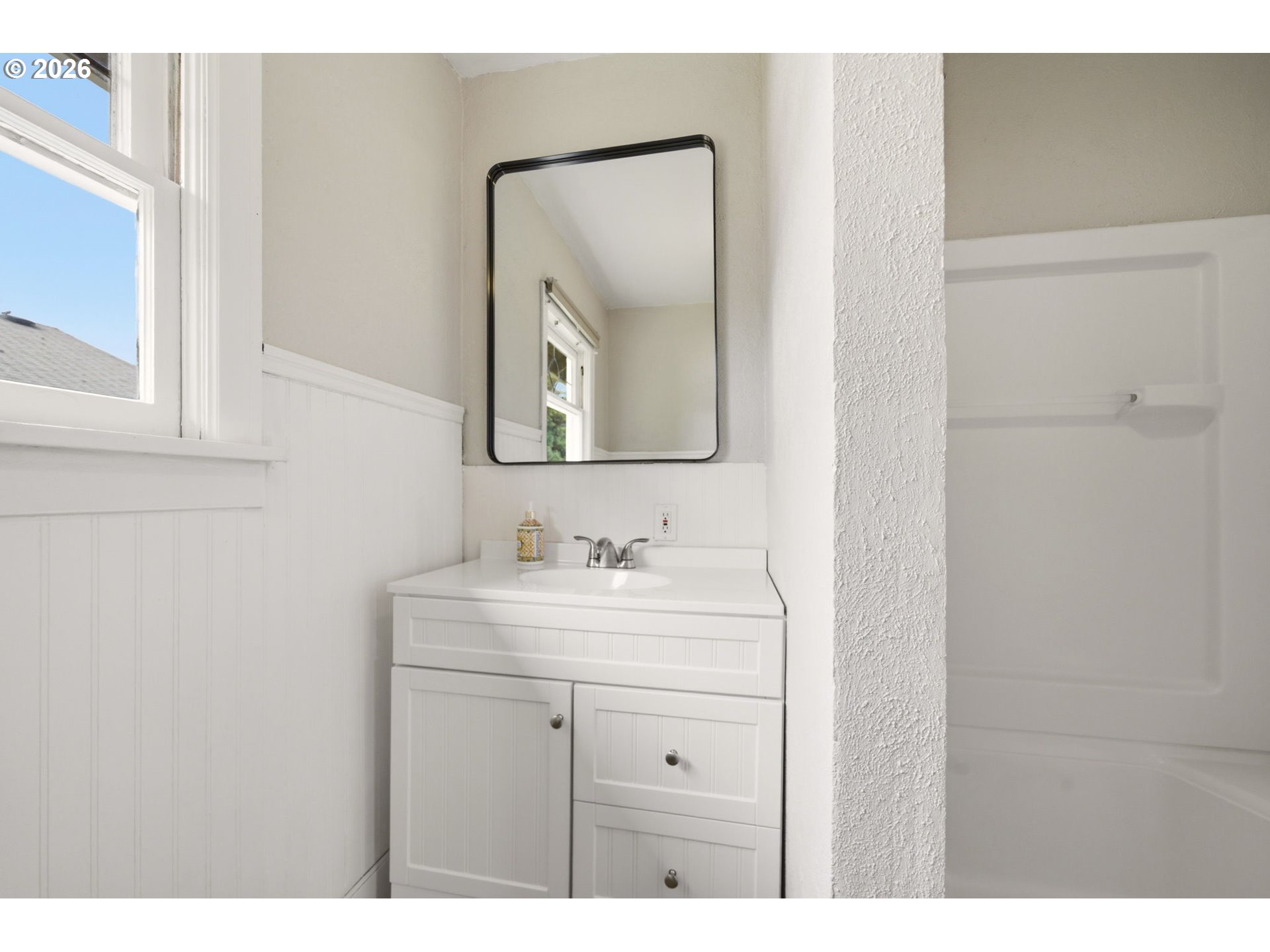 1804 Division Street Camas, WA 98607 - Photo 28 of 43 a bathroom with a sink vanity and mirror