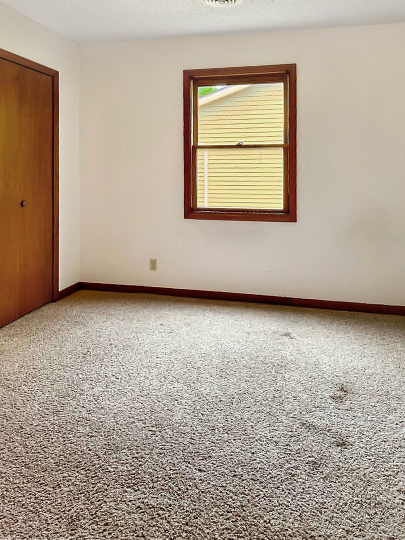1008 Ascot Drive Rantoul, IL 61866 - Photo 17 of 24 an empty room with a window