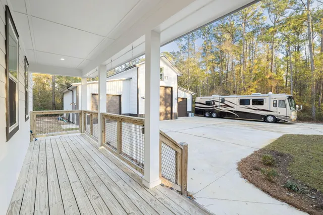 a bathroom with double vanity sink a shower and a mirror