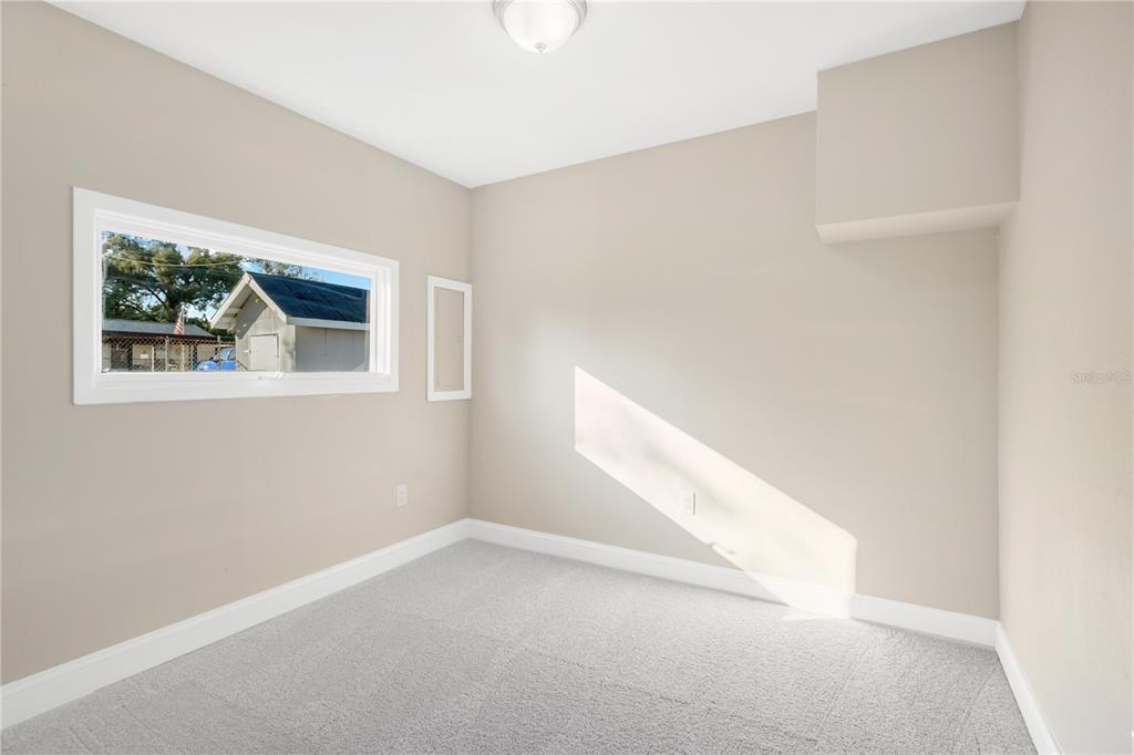 5226 Lime Avenue Seffner, FL 33584 - Photo 12 of 20 a view of empty room with window