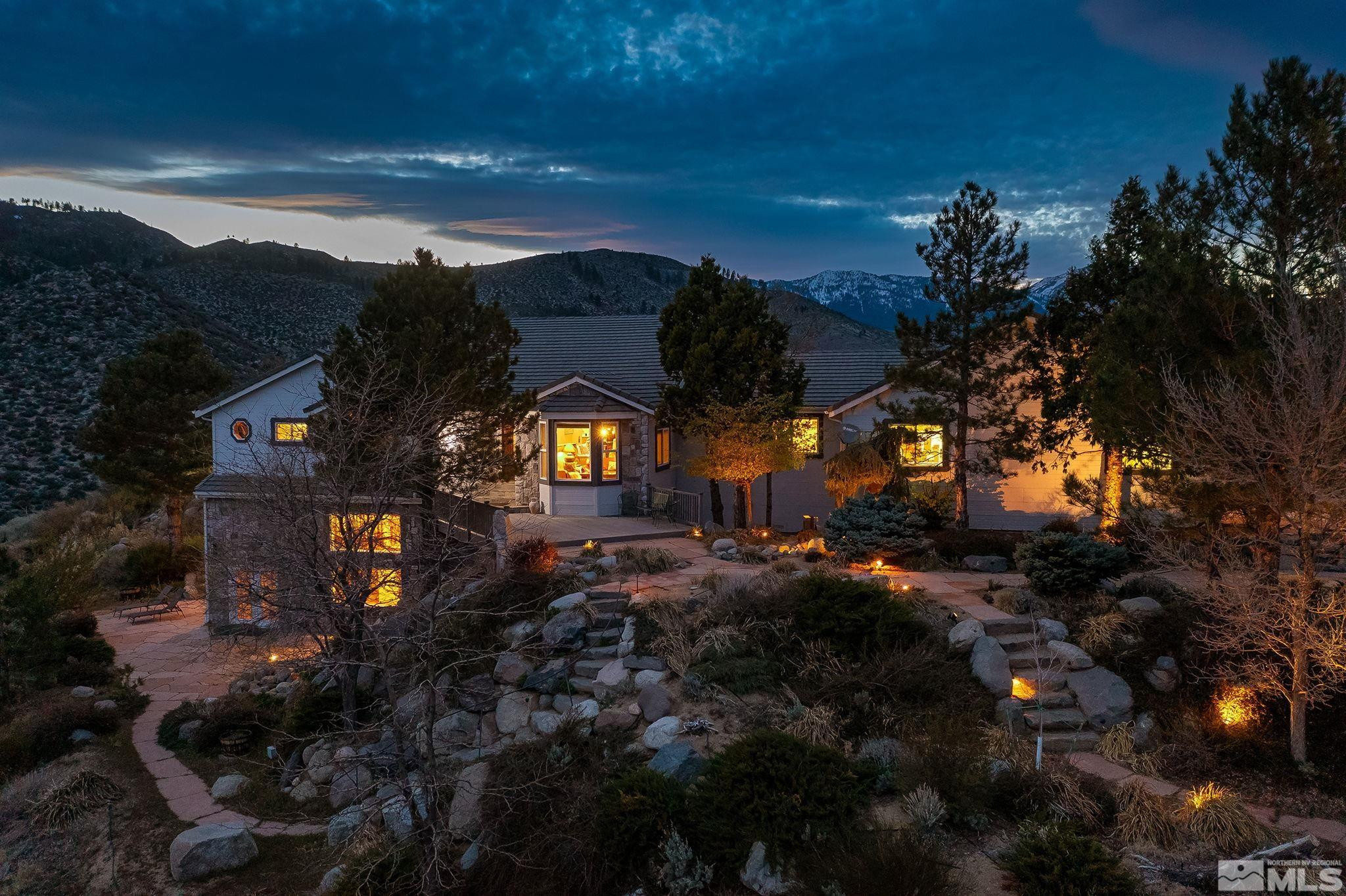 a view of a house with a street
