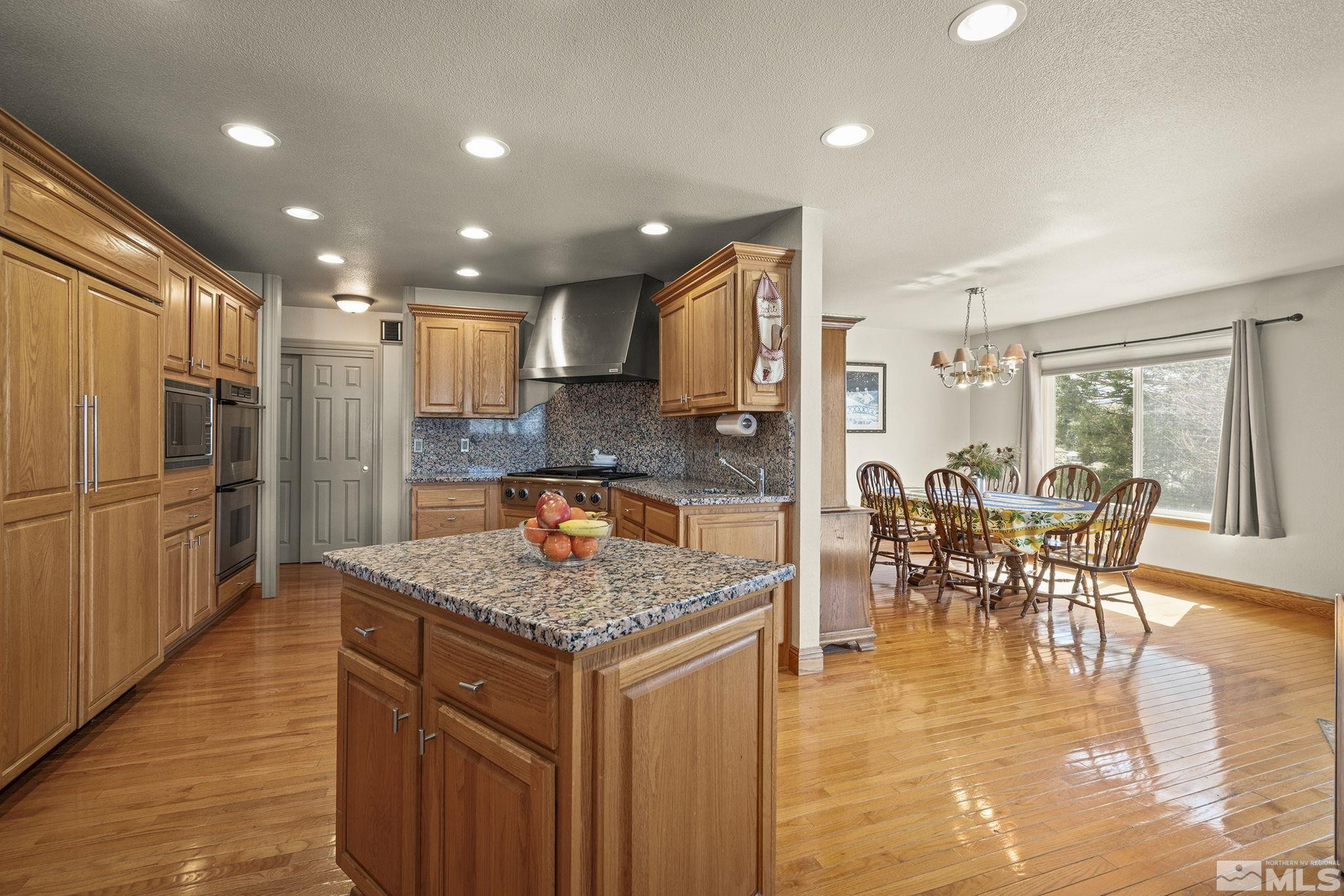 480 Duck Hill Road Washoe Valley, NV 89704 - Photo 18 of 46 a kitchen with a table and chairs in it