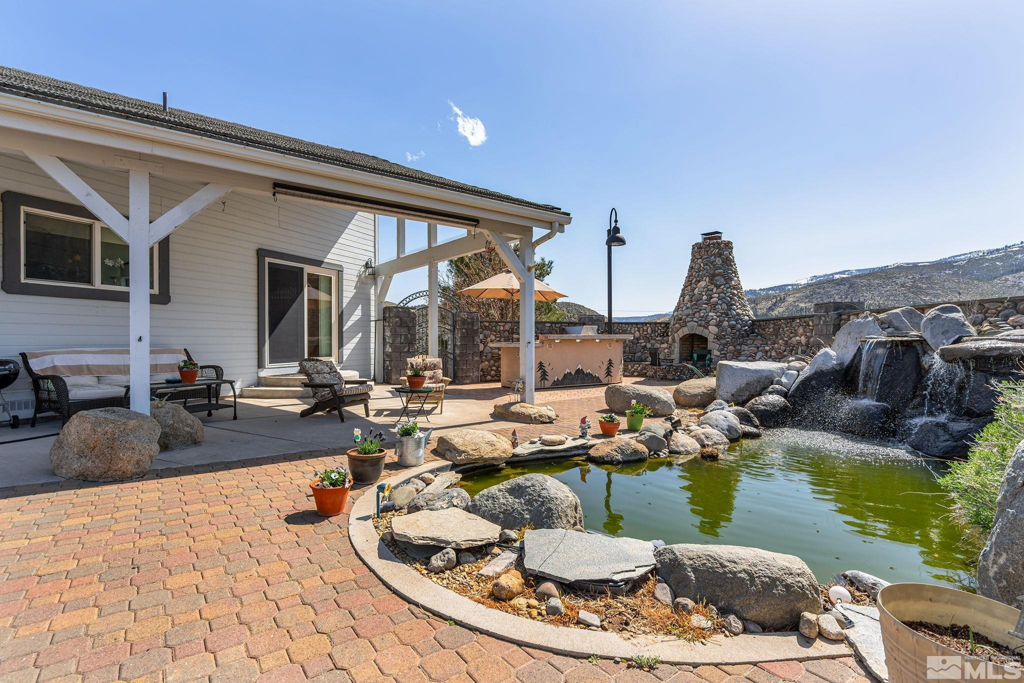 480 Duck Hill Road Washoe Valley, NV 89704 - Photo 29 of 46 a view of a swimming pool with outdoor seating