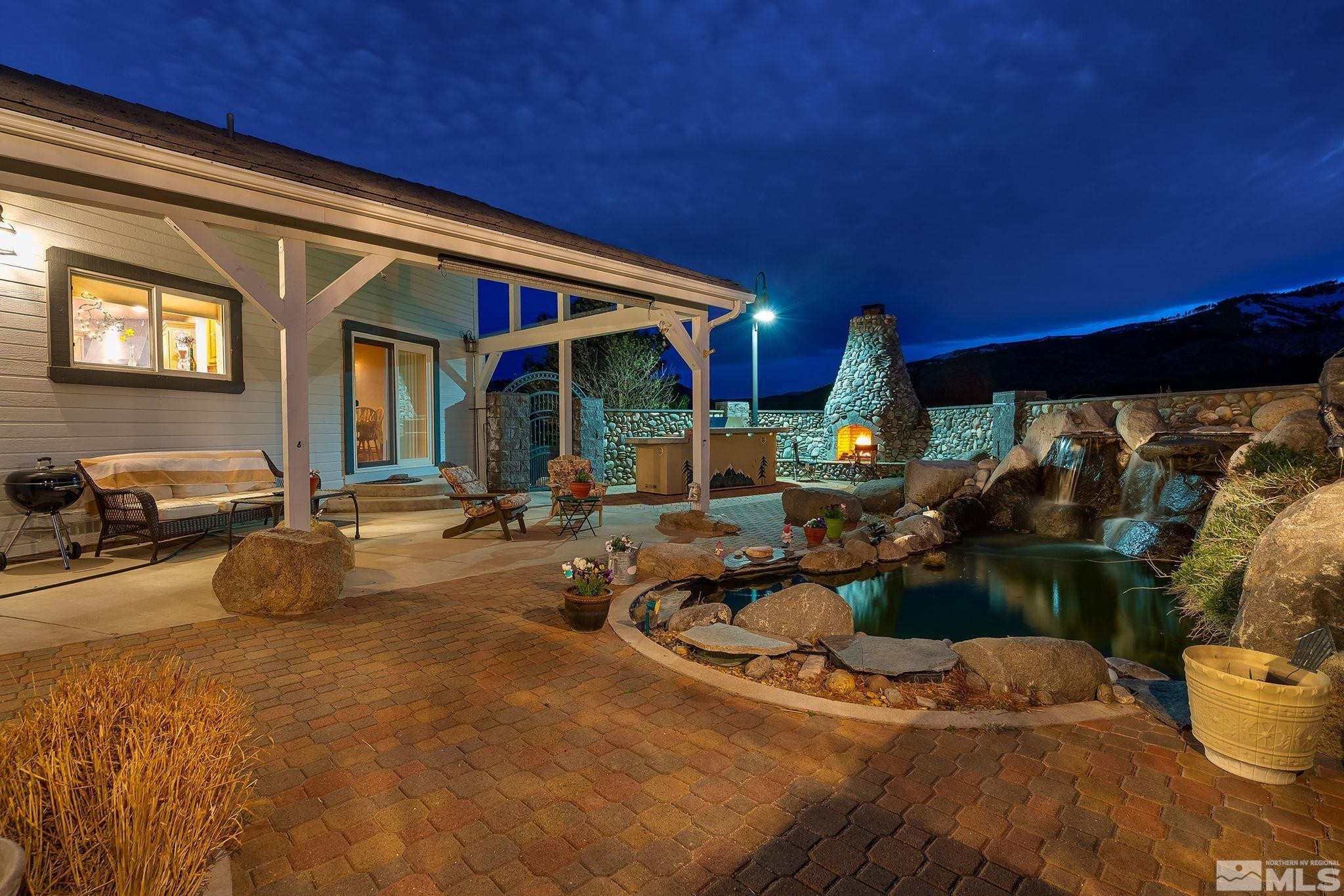 480 Duck Hill Road Washoe Valley, NV 89704 - Photo 30 of 46 a view of a chairs and table in the patio