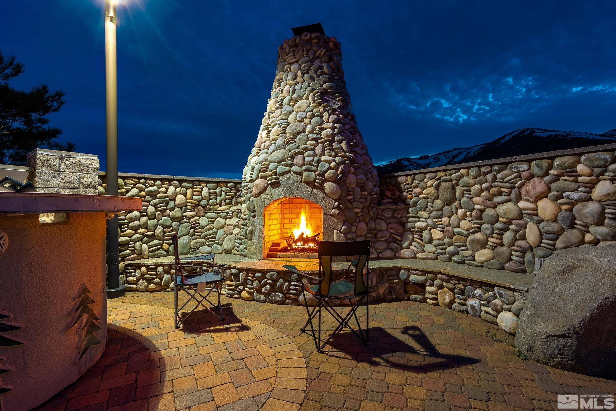 480 Duck Hill Road Washoe Valley, NV 89704 - Photo 33 of 46 a living room with furniture and a fireplace