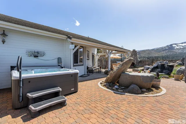 a view of living room with furniture and a wooden floor