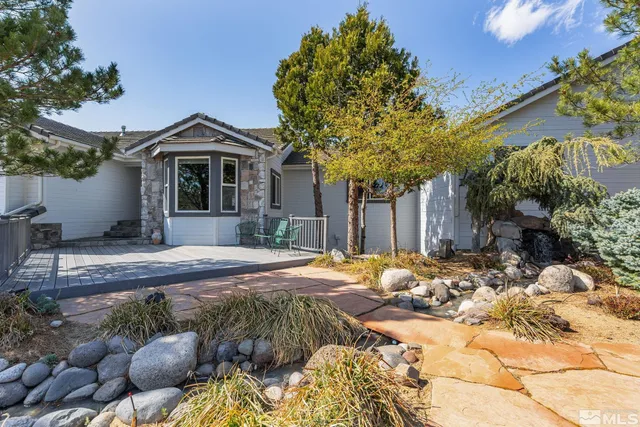 a front view of a house with yard