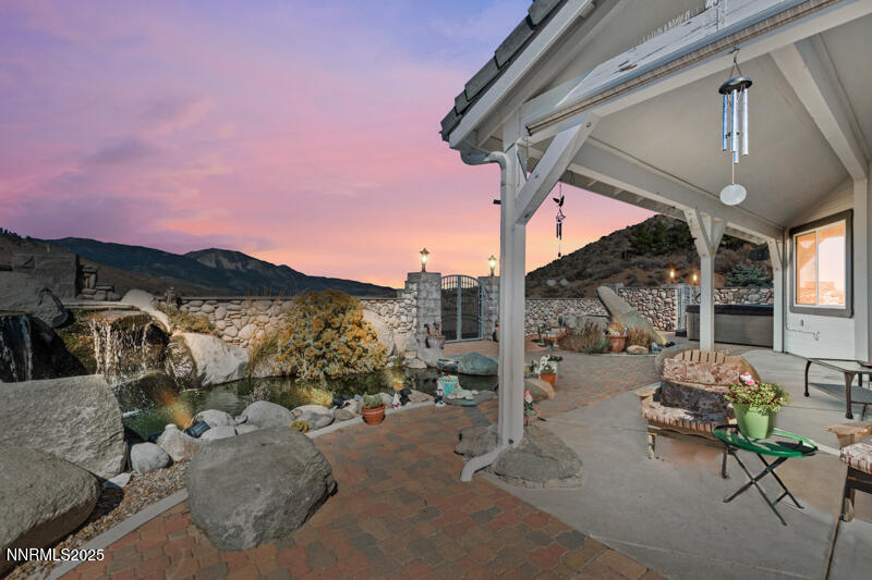 480 Duck Hill Road Washoe Valley, NV 89704 - Photo 44 of 46 a view of a patio with couches and table and chairs and potted plants