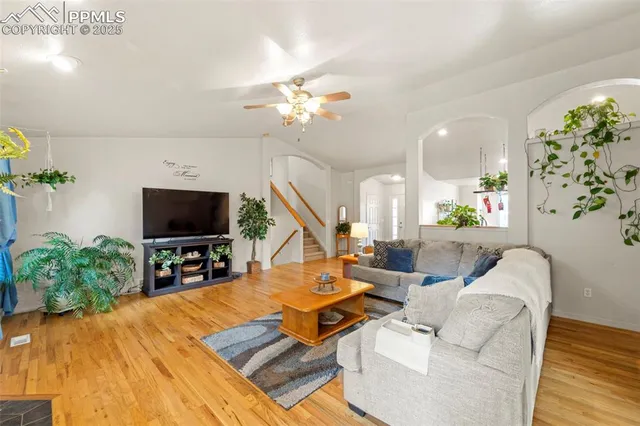 a living room with furniture and a flat screen tv