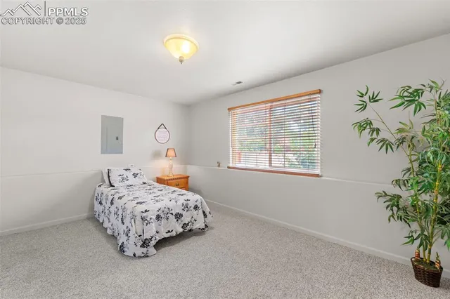 a bedroom with bed and a window