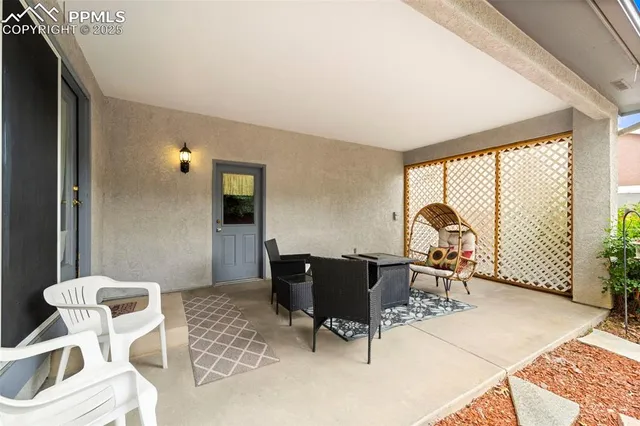 a view of a livingroom with furniture and a window