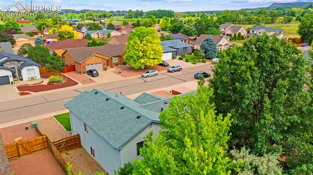 an aerial view of a house with a garden