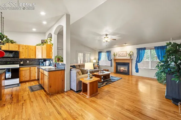a living room with furniture and a fireplace