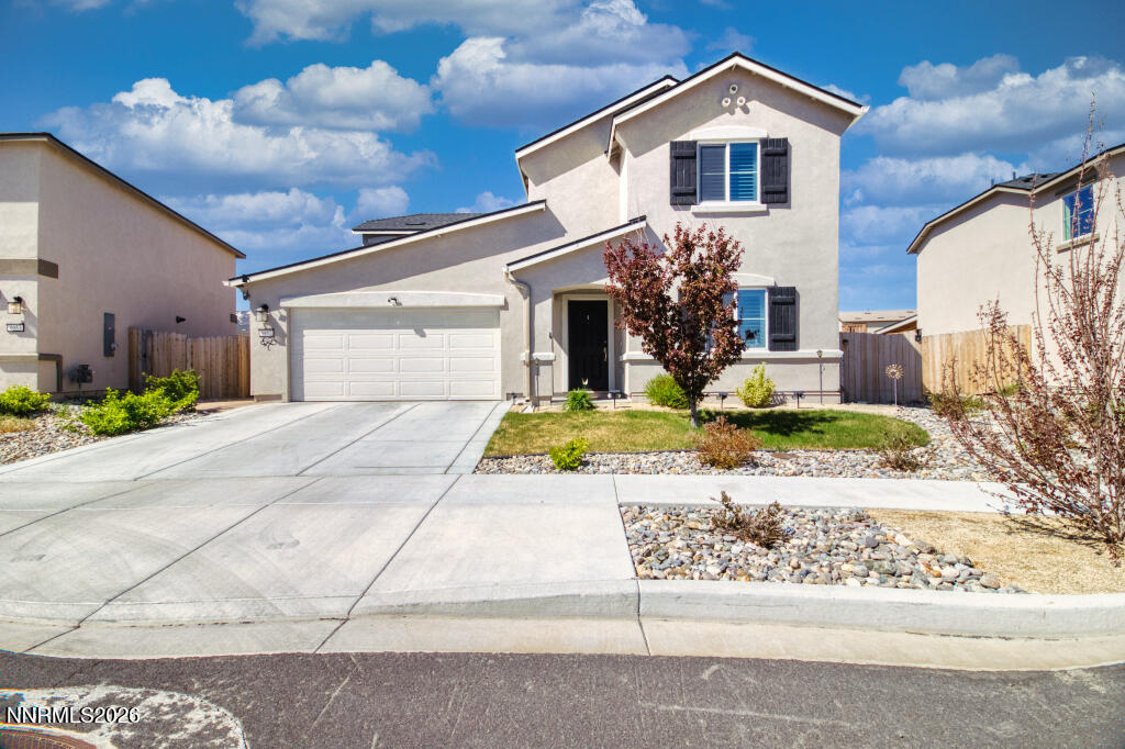 8957 Buffalo Grove Drive Reno, NV 89506 - Photo 4 of 59 a front view of a house with a yard
