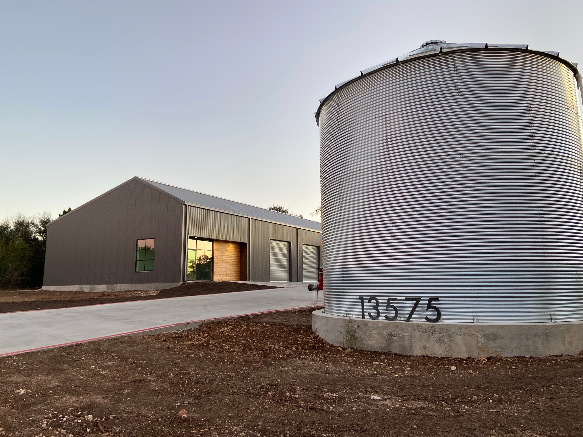 13575 Fitzhugh Road, Unit 100 Austin, TX 78737 - Photo 2 of 10 a front view of a house with a yard