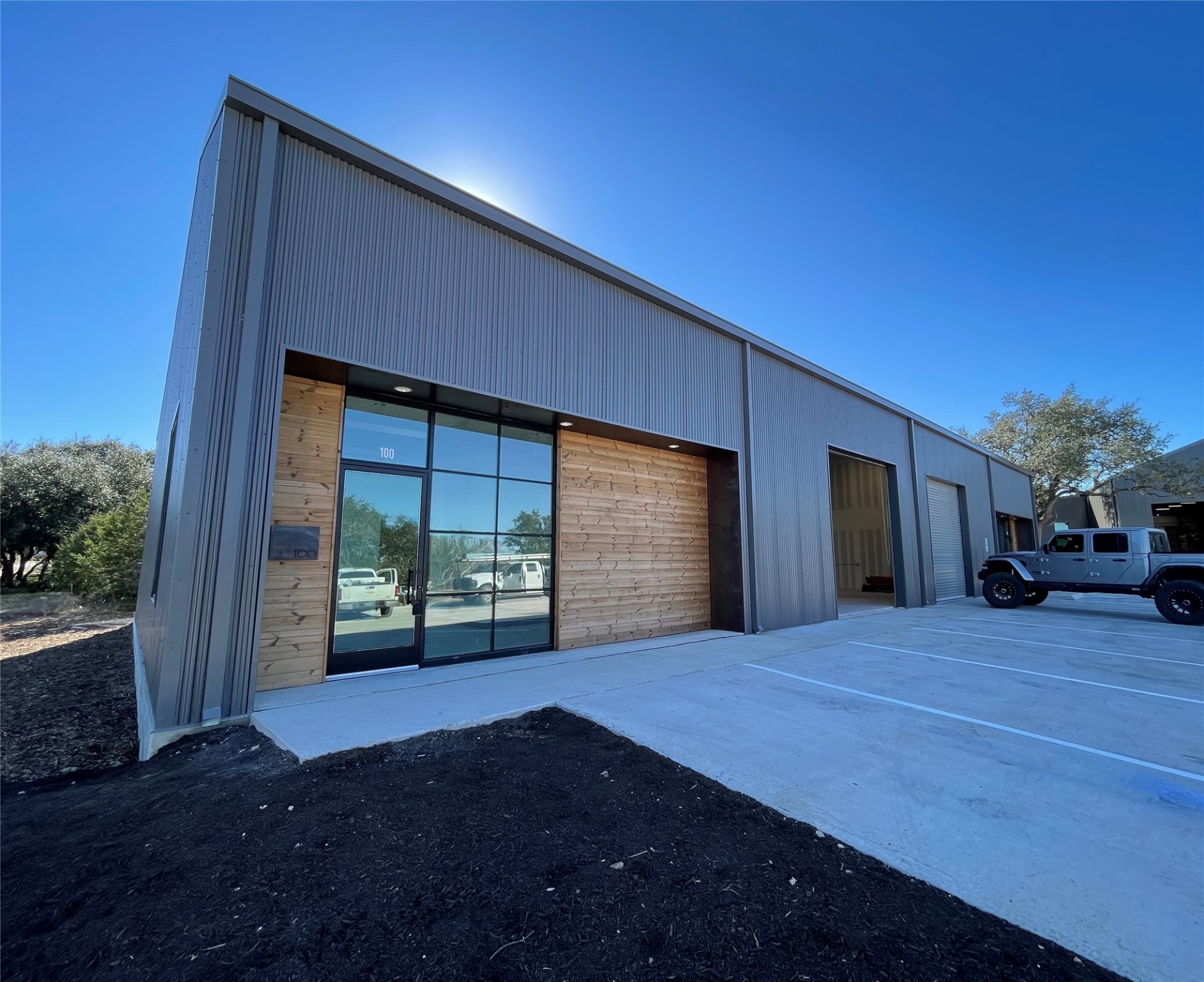 13575 Fitzhugh Road, Unit 100 Austin, TX 78737 - Photo 3 of 10 a front view of a house with a yard