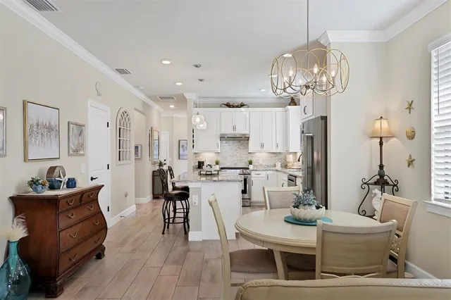 a living room with furniture large windows and a flat screen tv