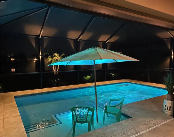a view of a swimming pool with a lounge chairs