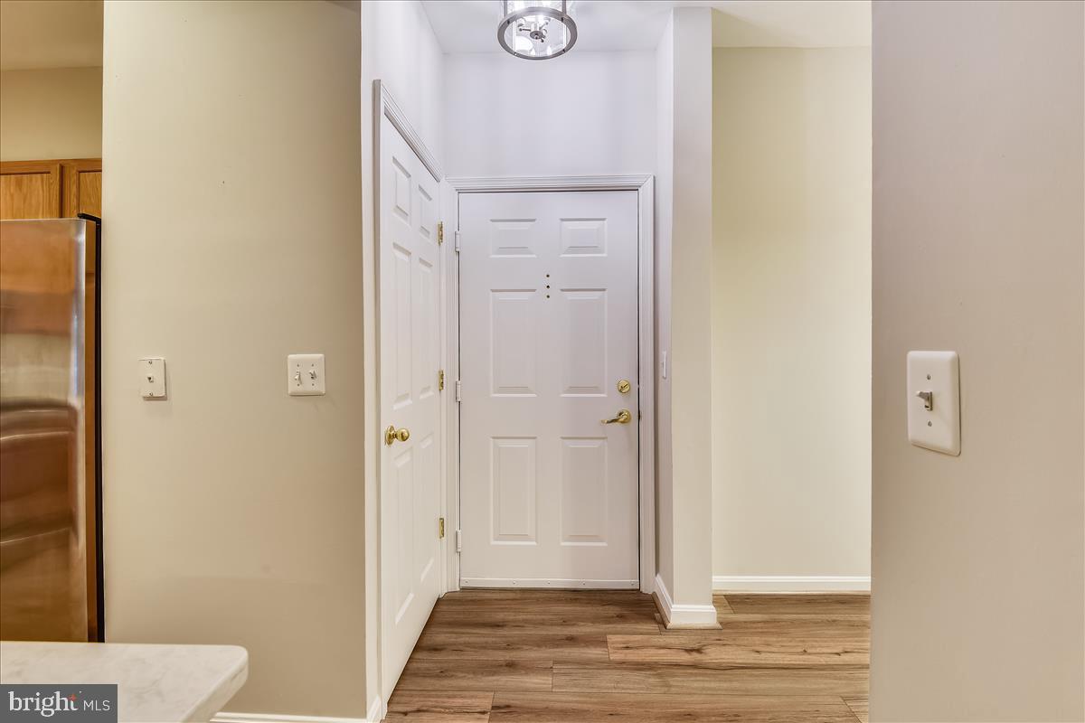 2931 Deer Hollow Way, Unit 102 Fairfax, VA 22031 - Photo 15 of 86 a view of a bathroom with wooden floor
