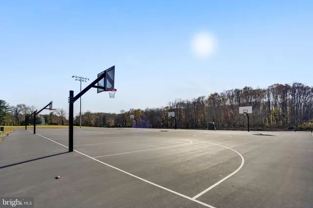 a couple of cars parked in front of a house