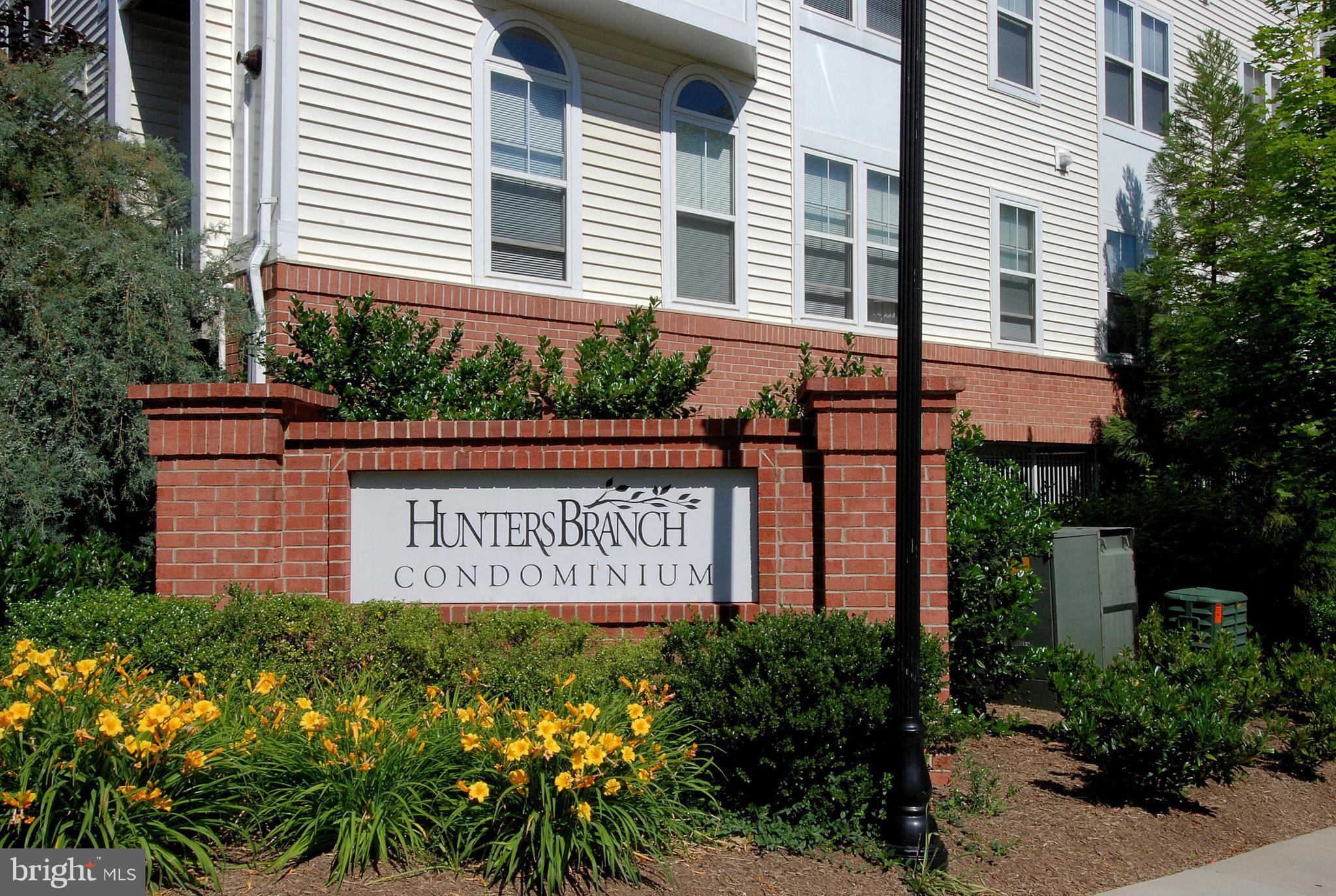 2931 Deer Hollow Way, Unit 102 Fairfax, VA 22031 - Photo 44 of 86 a sign on the side of a building