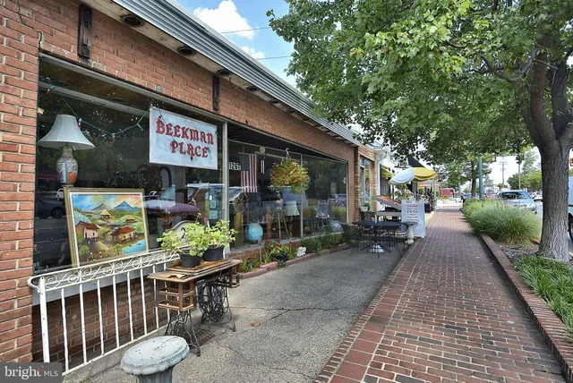 a view of outdoor space with sign board and garden