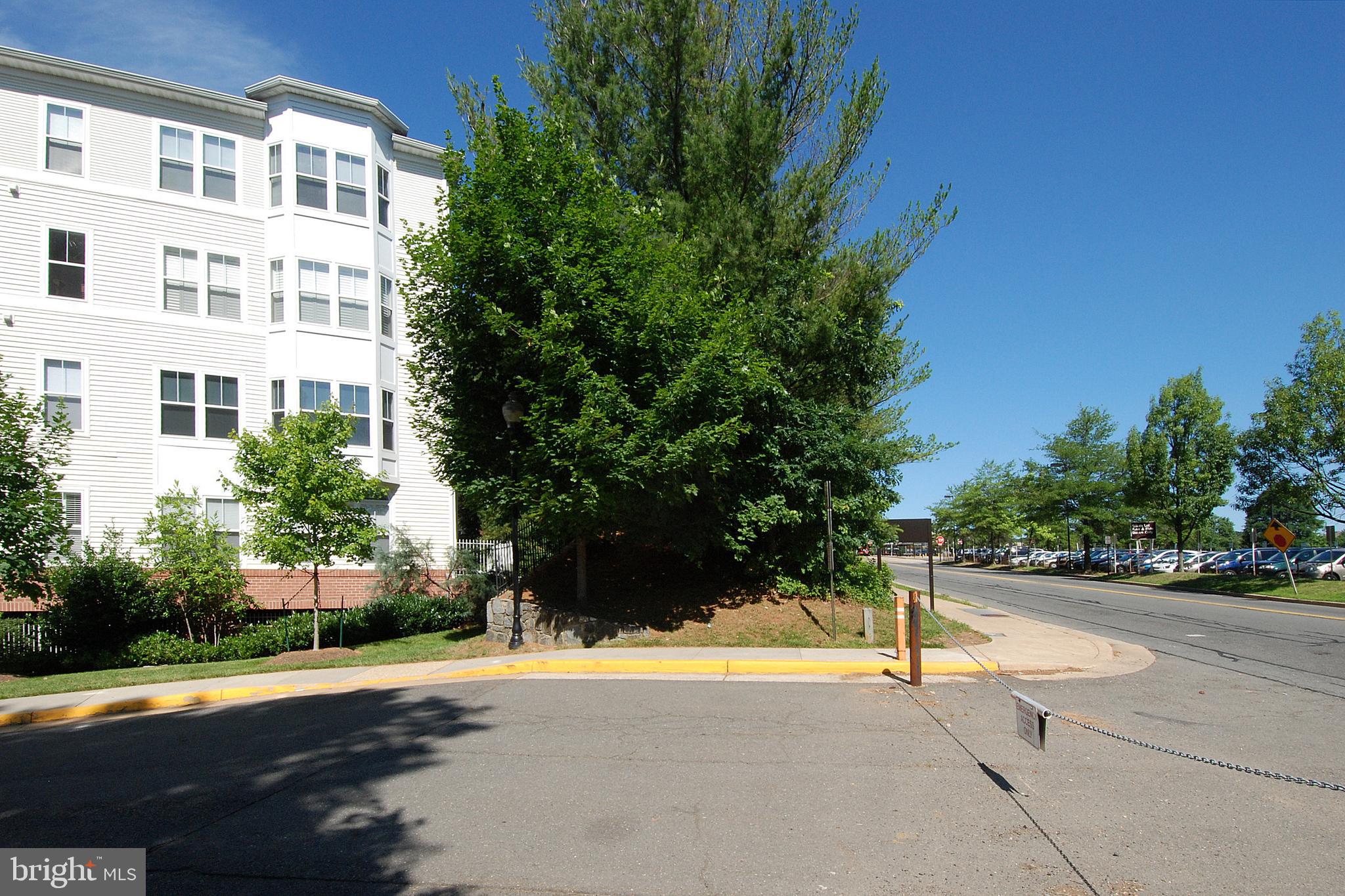 2931 Deer Hollow Way, Unit 102 Fairfax, VA 22031 - Photo 78 of 86 a view of a street with a building in the background
