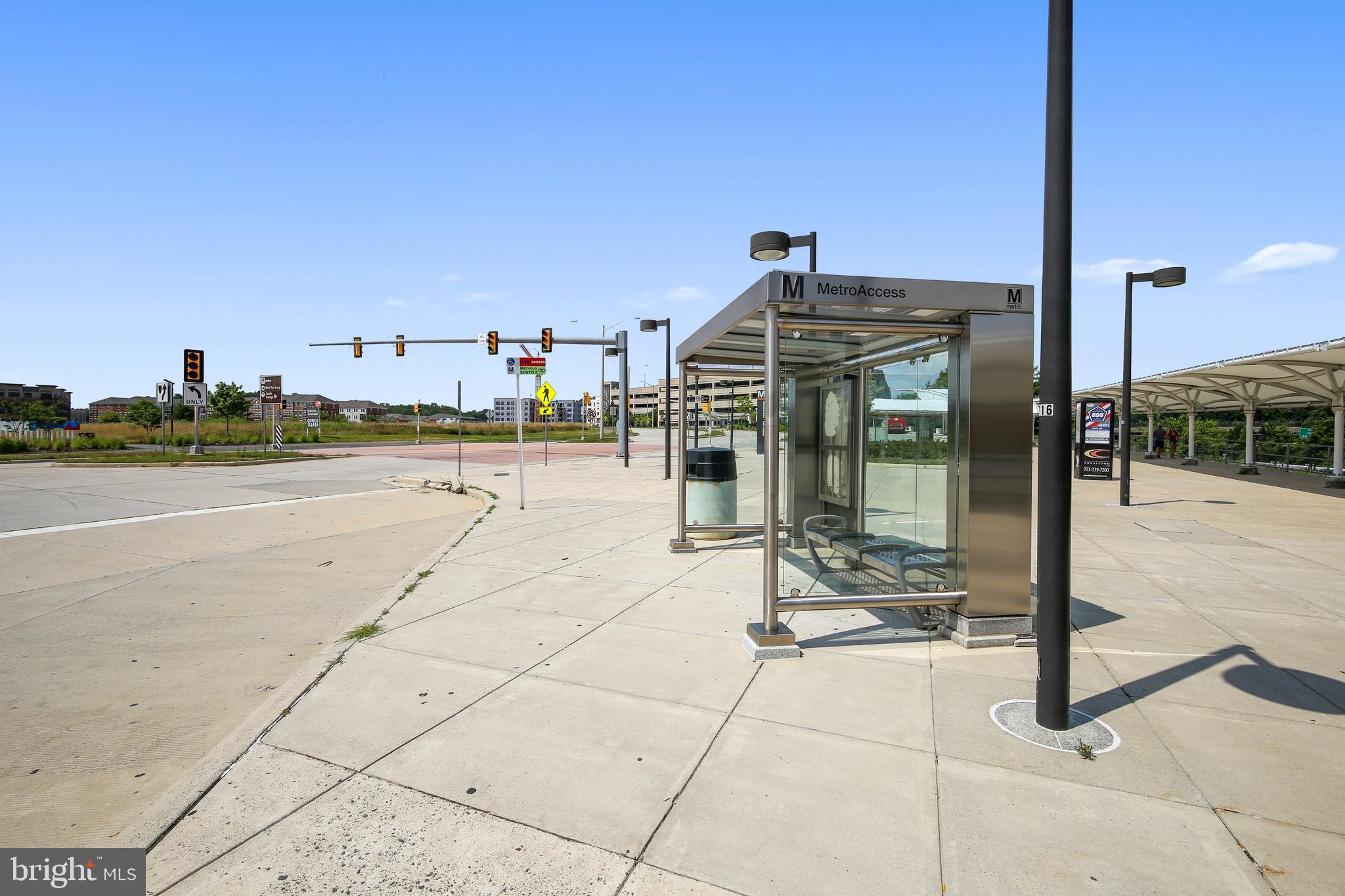 2931 Deer Hollow Way, Unit 102 Fairfax, VA 22031 - Photo 81 of 86 a view of a terrace with wooden floor and city view