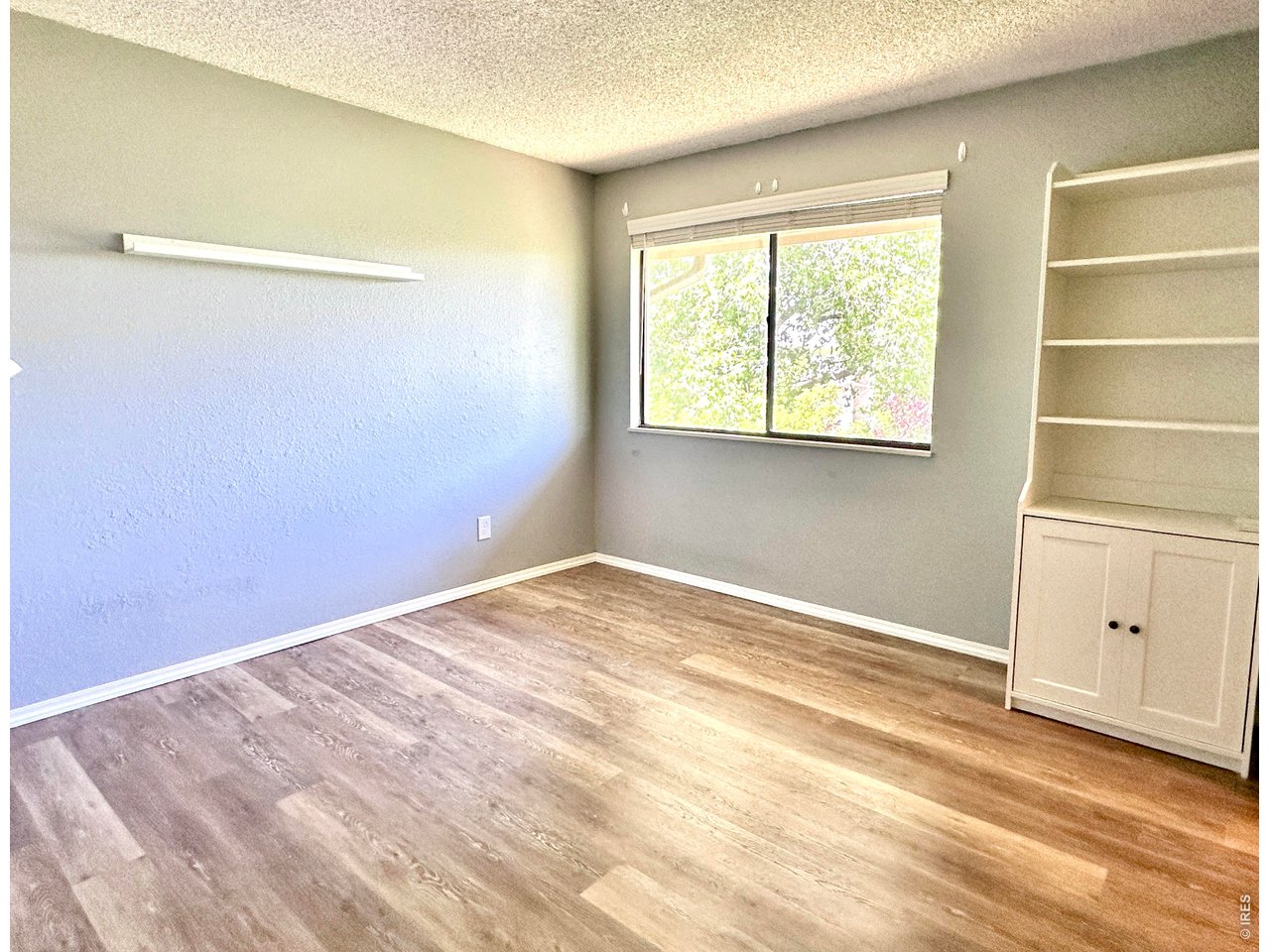 1705 Heatheridge Road, Unit 205 Fort Collins, CO 80526 - Photo 9 of 17 Large bedroom overlooking Red Fox Natural area