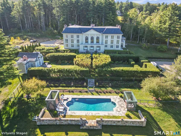 a view of swimming pool with outdoor seating and yard
