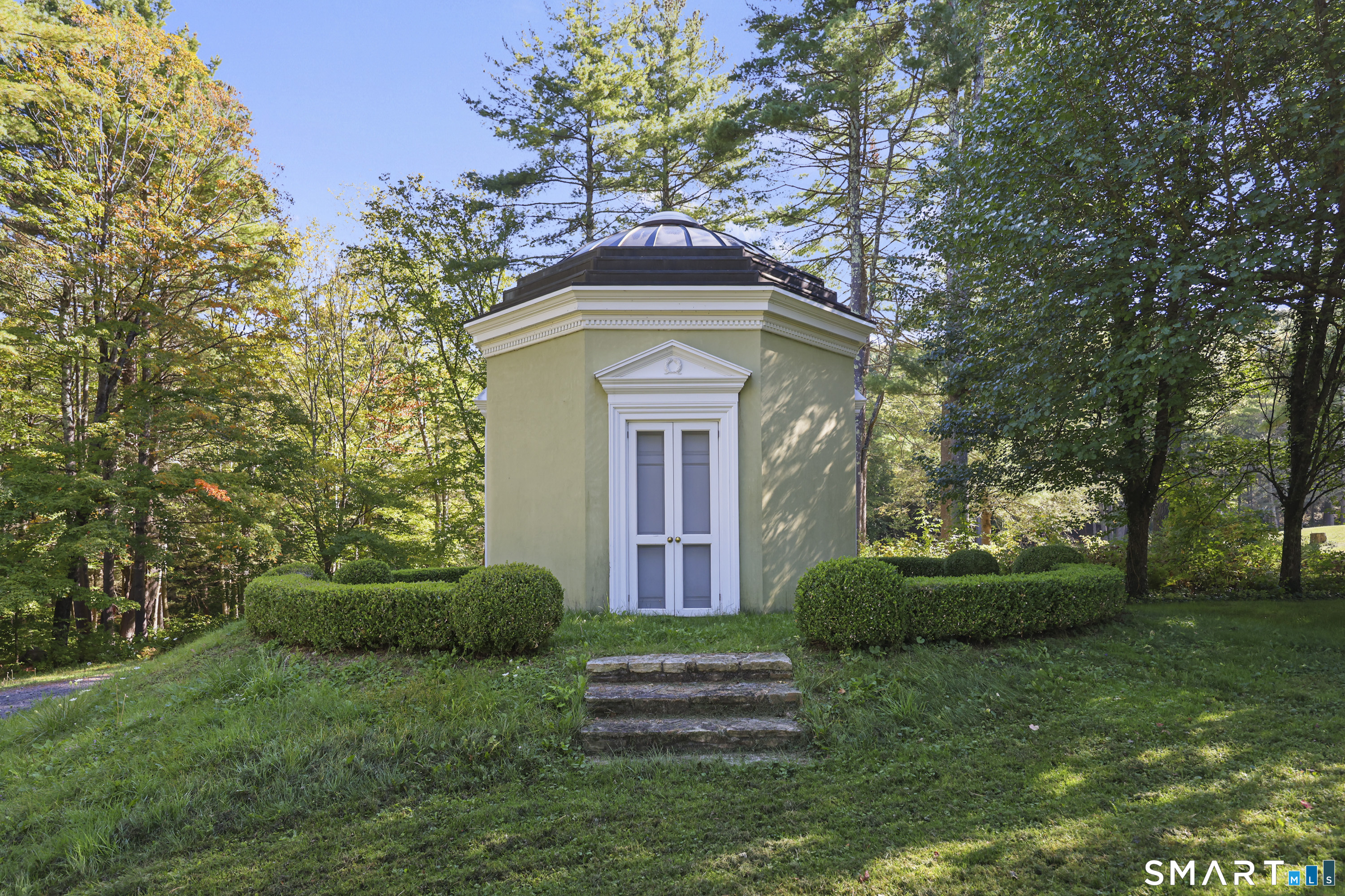 209 Blue Hill Road Great Barrington, MA 01230 - Photo 33 of 37 a front view of a house with garden