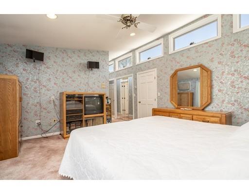 33 Lockeland Road Winchester, MA 01890 - Photo 17 of 28 a bedroom with a bed and a flat screen tv