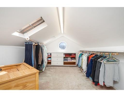 33 Lockeland Road Winchester, MA 01890 - Photo 18 of 28 a view of walk in closet with clothes and shoes