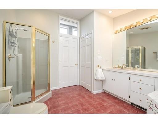 33 Lockeland Road Winchester, MA 01890 - Photo 20 of 28 a bathroom with a granite countertop sink mirror and a shower