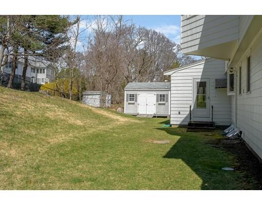 33 Lockeland Road Winchester, MA 01890 - Photo 27 of 28 a backyard of a house with table and chairs