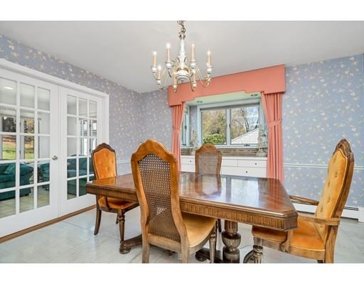 33 Lockeland Road Winchester, MA 01890 - Photo 5 of 28 a view of a dining room with furniture and chandelier