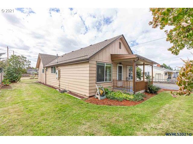 2455 G Street Springfield, OR 97477 - Photo 2 of 32 a backyard of a house with table and chairs