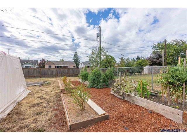 2455 G Street Springfield, OR 97477 - Photo 24 of 32 a view of swimming pool with a yard