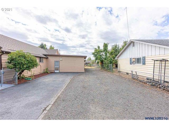 2455 G Street Springfield, OR 97477 - Photo 26 of 32 a view of a house with backyard and roof