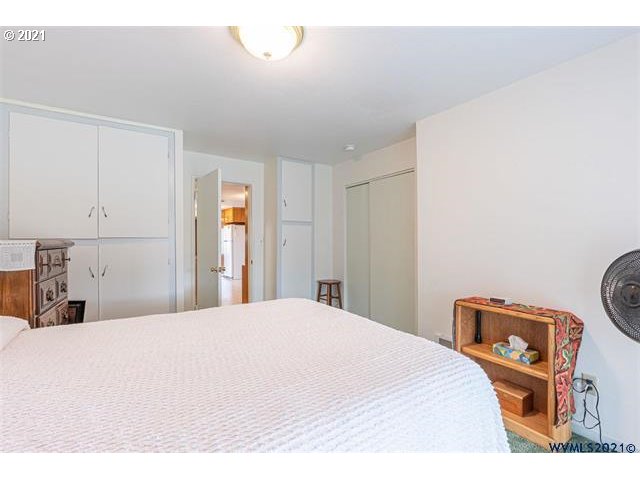 2455 G Street Springfield, OR 97477 - Photo 6 of 32 a bedroom with a bed and a dresser
