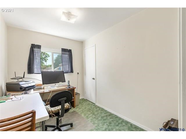 2455 G Street Springfield, OR 97477 - Photo 9 of 32 a workspace with furniture and a wooden floor