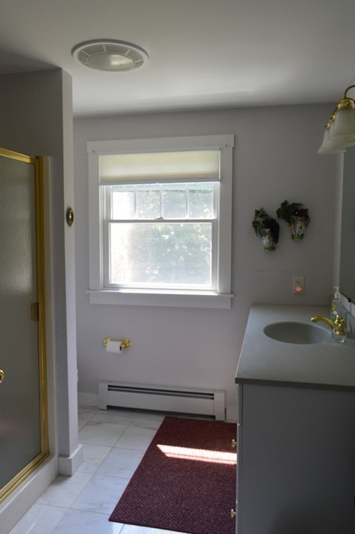 15 Ed Clark Road Hubbardston, MA 01452 - Photo 9 of 19 a bathroom with a sink and a window