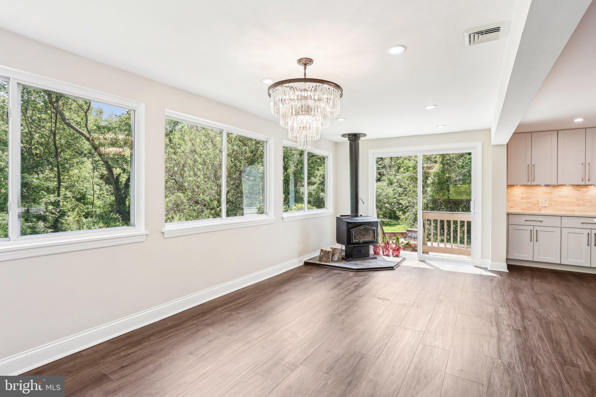 302 Fenwick Road Pilesgrove, NJ 08098 - Photo 11 of 51 a view of a room with wooden floor and large window