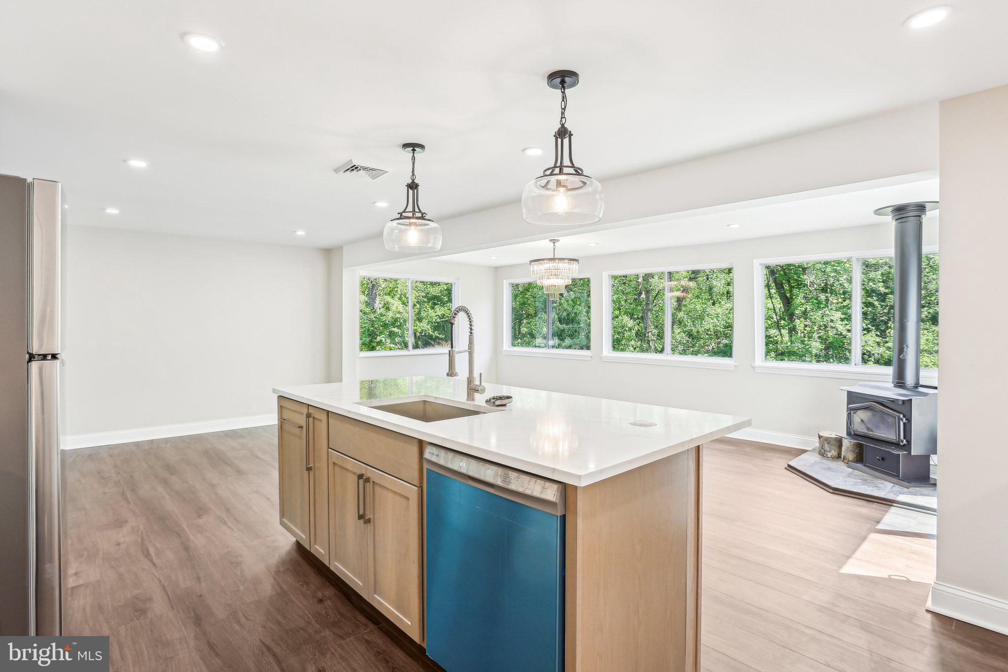 302 Fenwick Road Pilesgrove, NJ 08098 - Photo 18 of 51 a view of a kitchen counter space a sink and windows